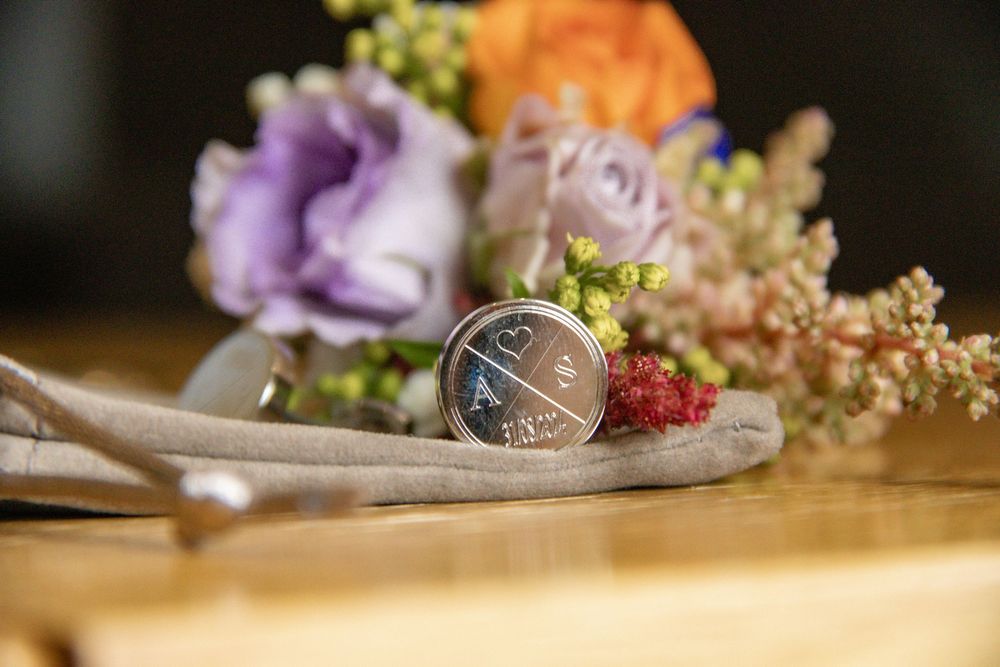 Delicate purple and orange flower arrangements with vintage styling details.
