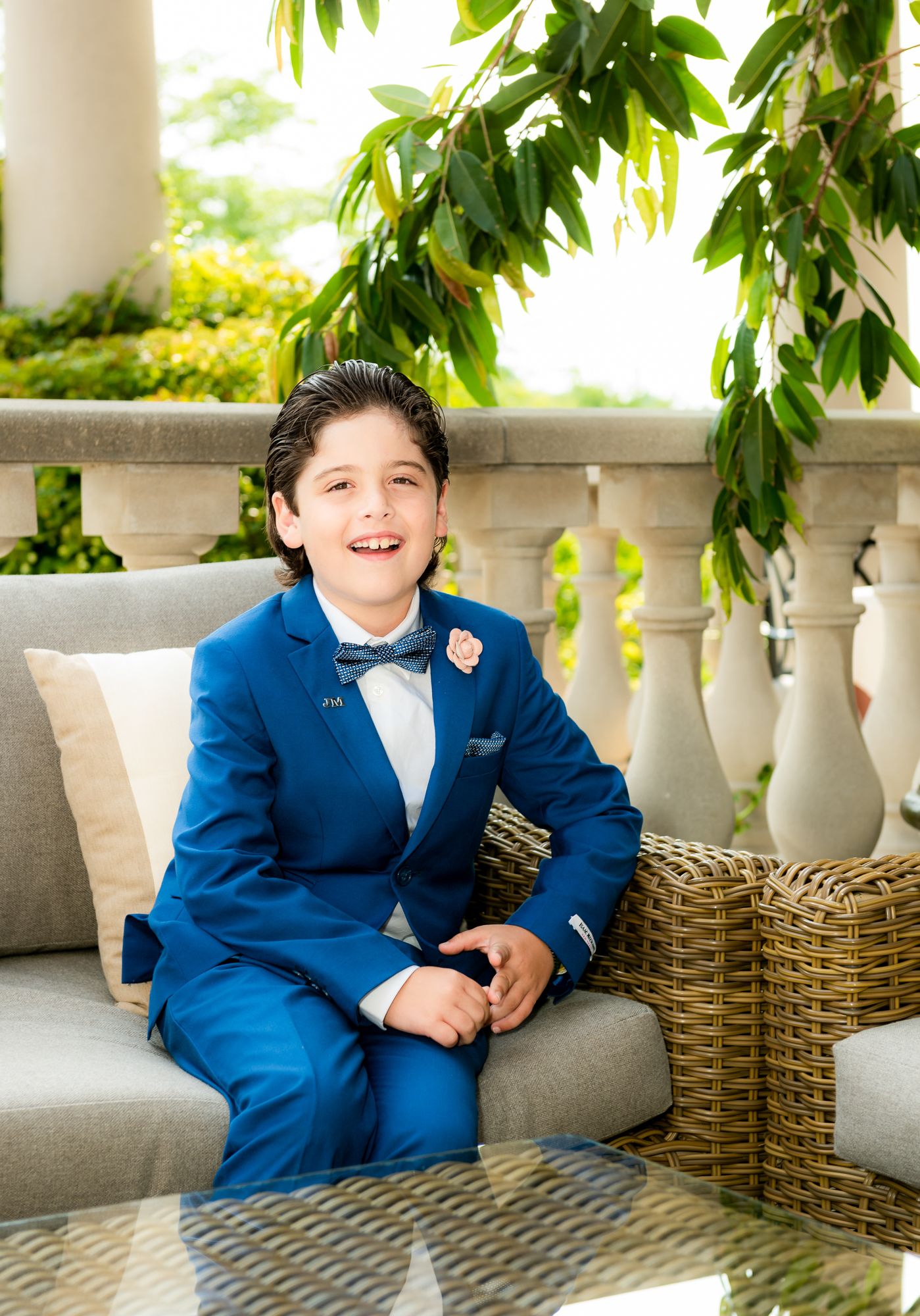 first communion event photography for a boy being photographed in the natural light setup outside at Magna golf club