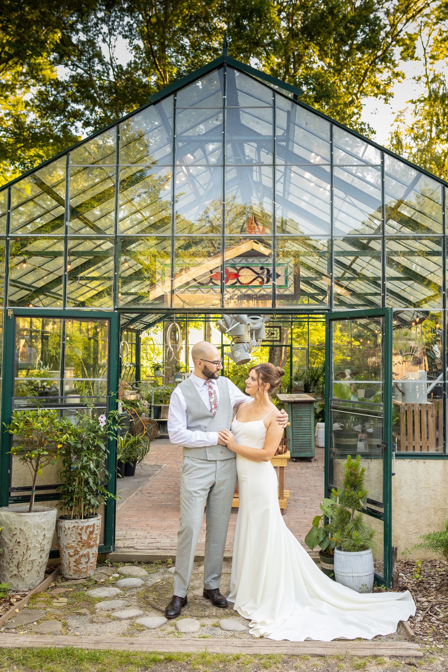 Peconic River Herb Farm: Bride and groom portrait inside the greenhouse at Peconic River Herb Farm in Calverton, New York.