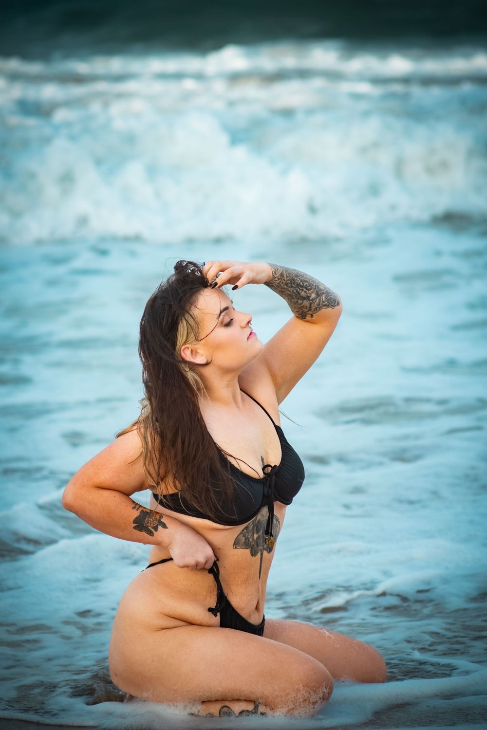 Artistic beach portraits with ocean waves in background.