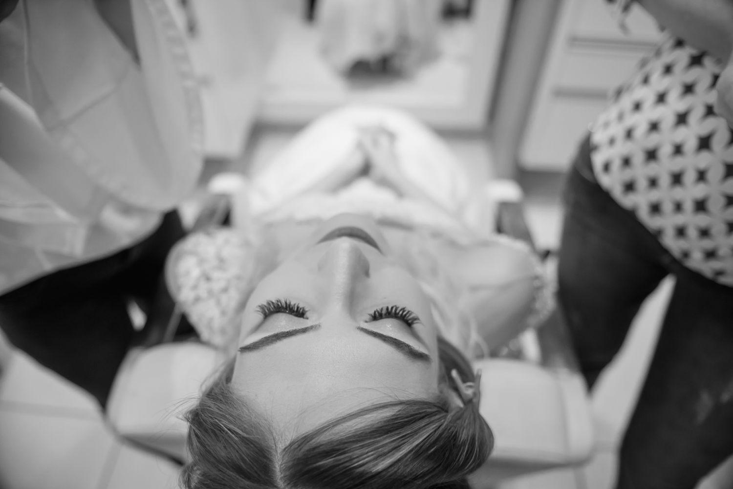 Artistic black and white overhead portrait during wedding preparations.