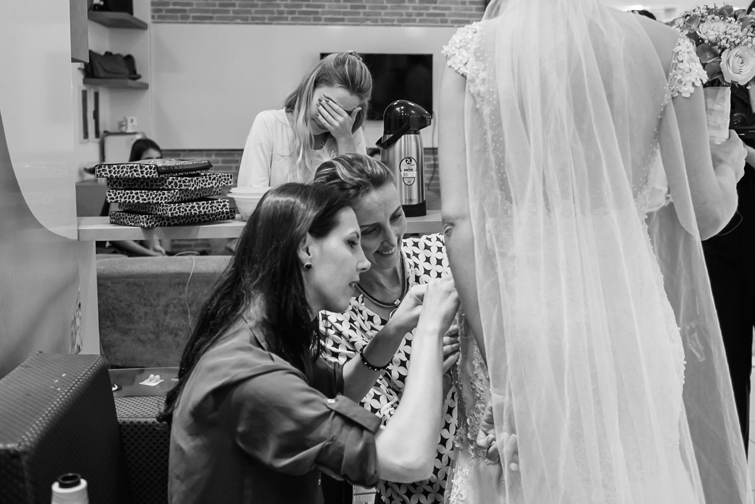 Wedding dress alterations being made during a bridal fitting session.