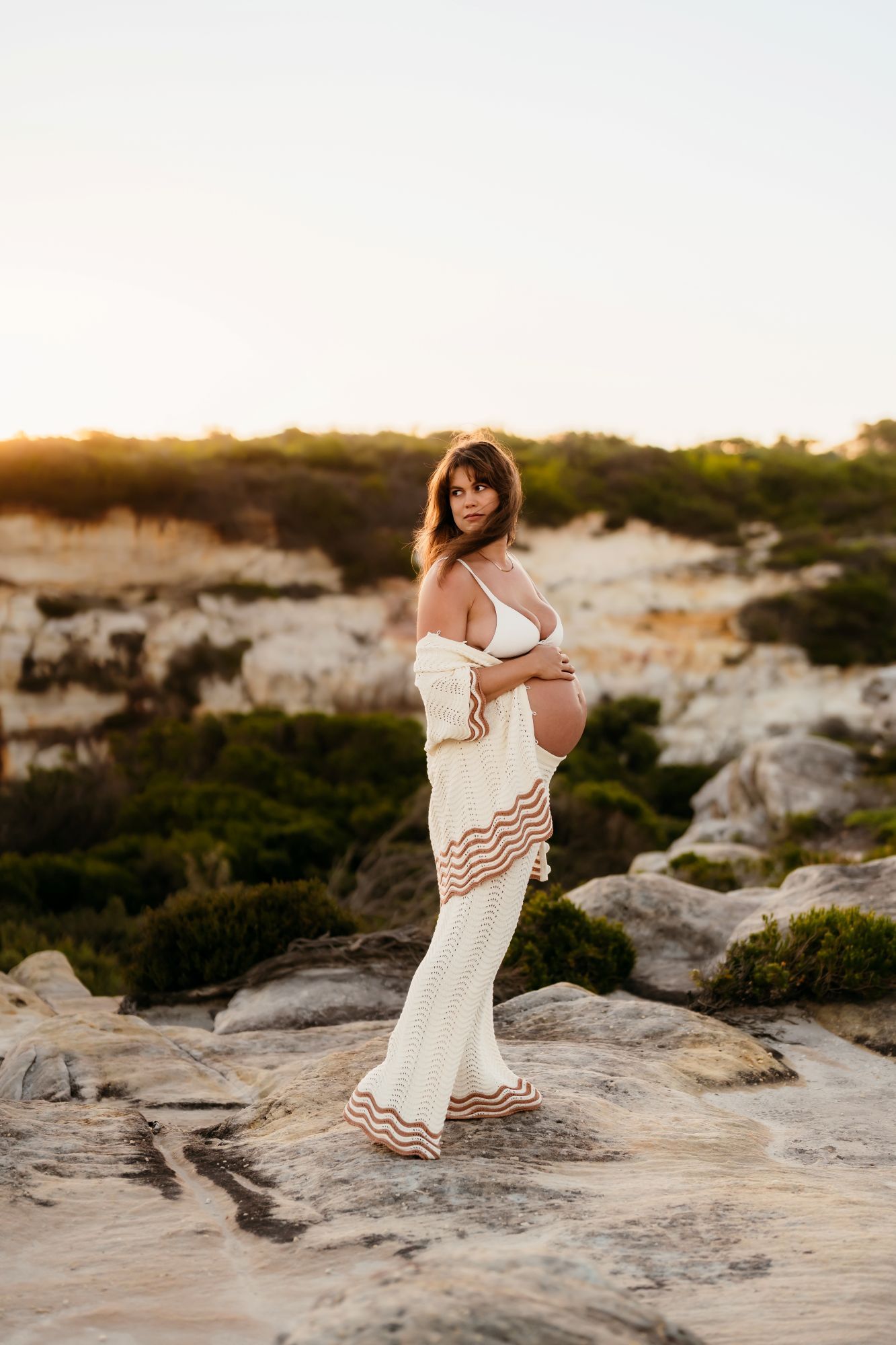 Natural mother photographed during pregnancy in crochet set