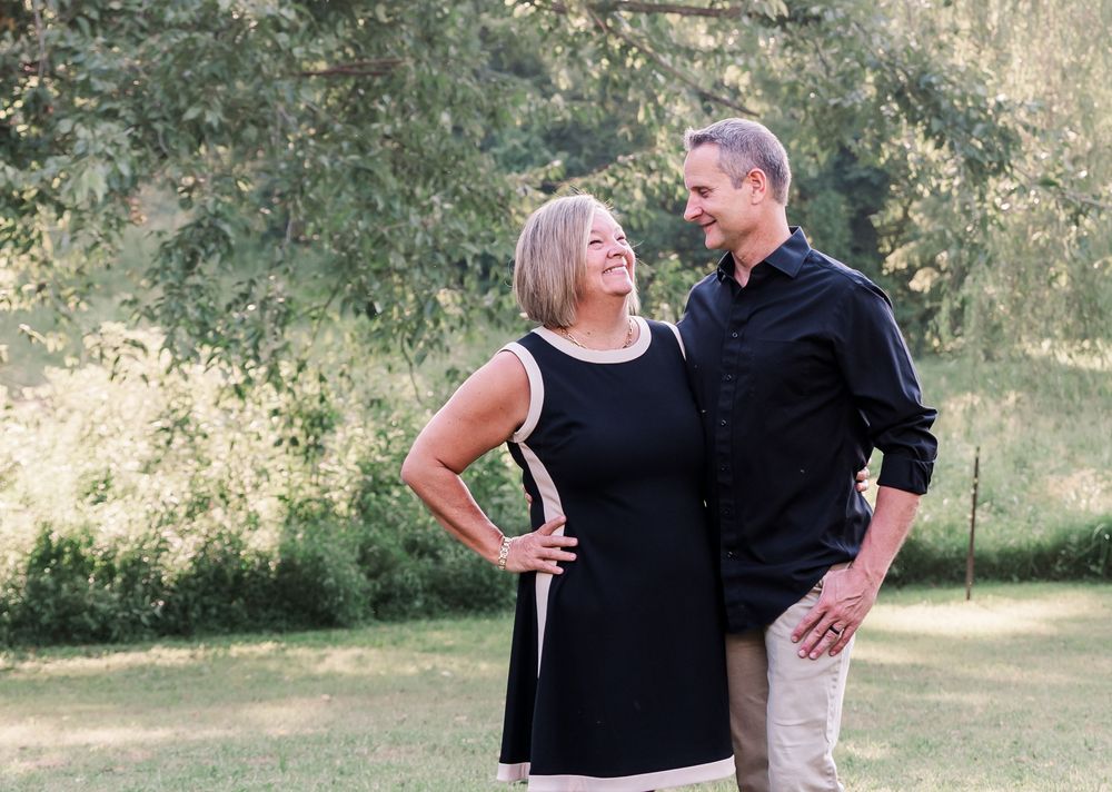 Married couple embracing each other for a photo in Kuttawa, Kentucky.