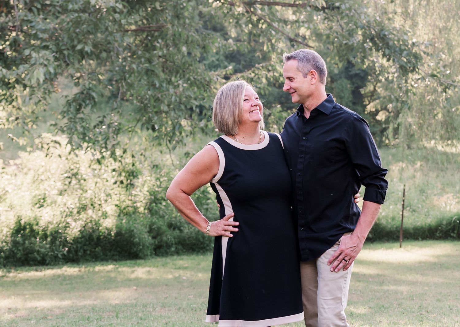 Married couple embracing each other for a photo in Kuttawa, Kentucky.