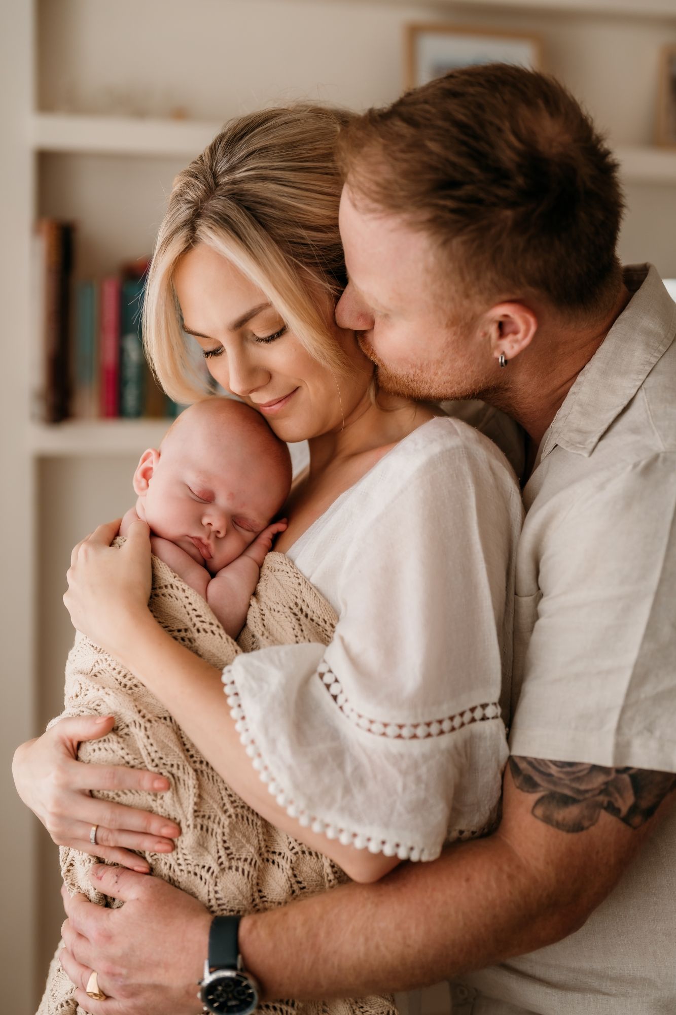Cuddly couple with newborn in their home - Based in Sydney - Photography