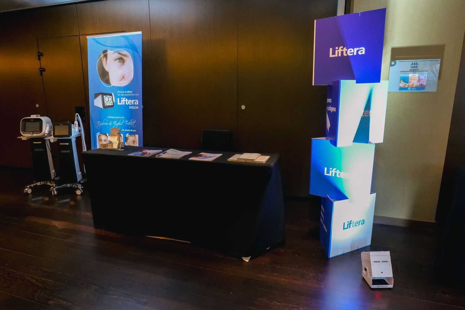 Liftera brand exhibition booth with promotional display stand and brochures at a medical conference.