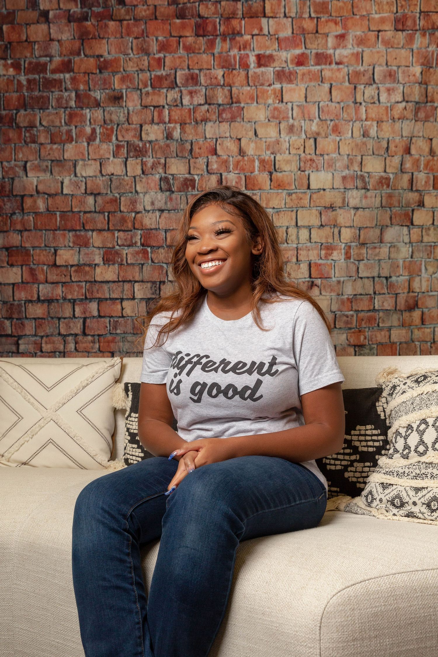 Woman wearing "different is good" t-shirt portrait.