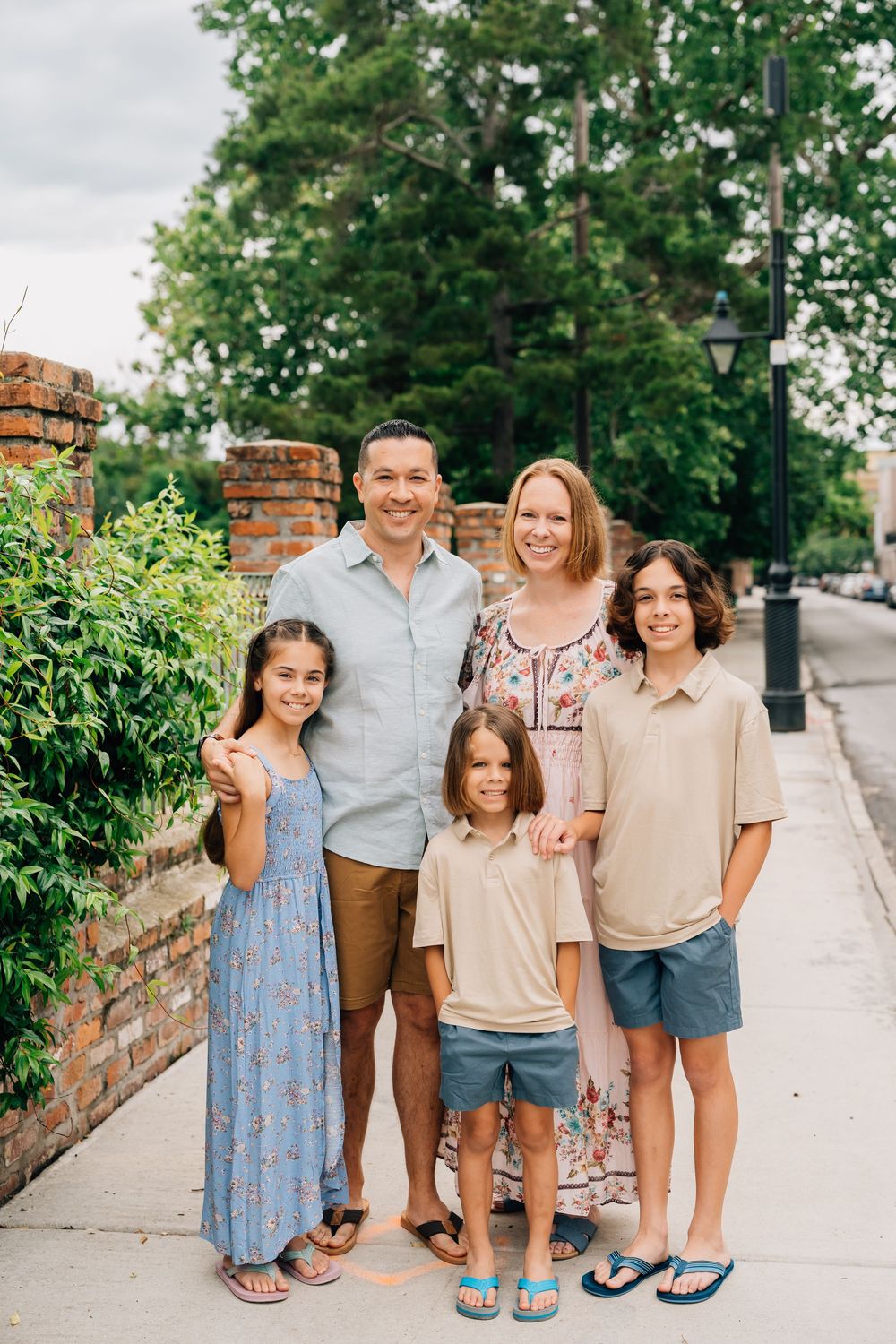 A family smiling at the camera in the French Quarter