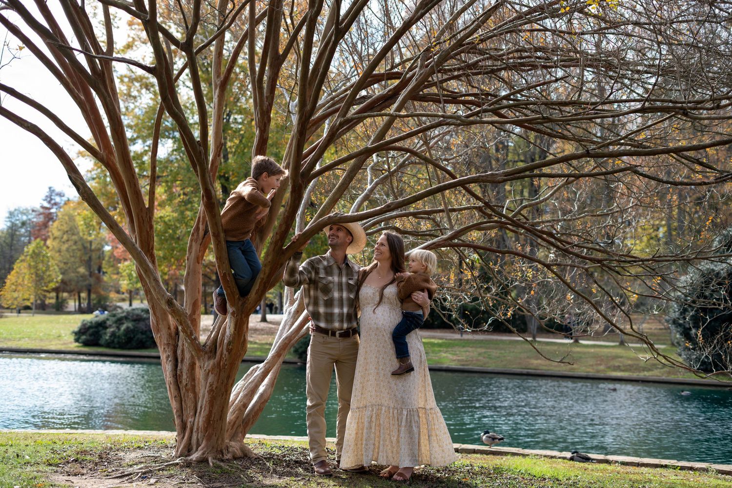 Joyful family moments in a Charlotte park documented with a timeless style