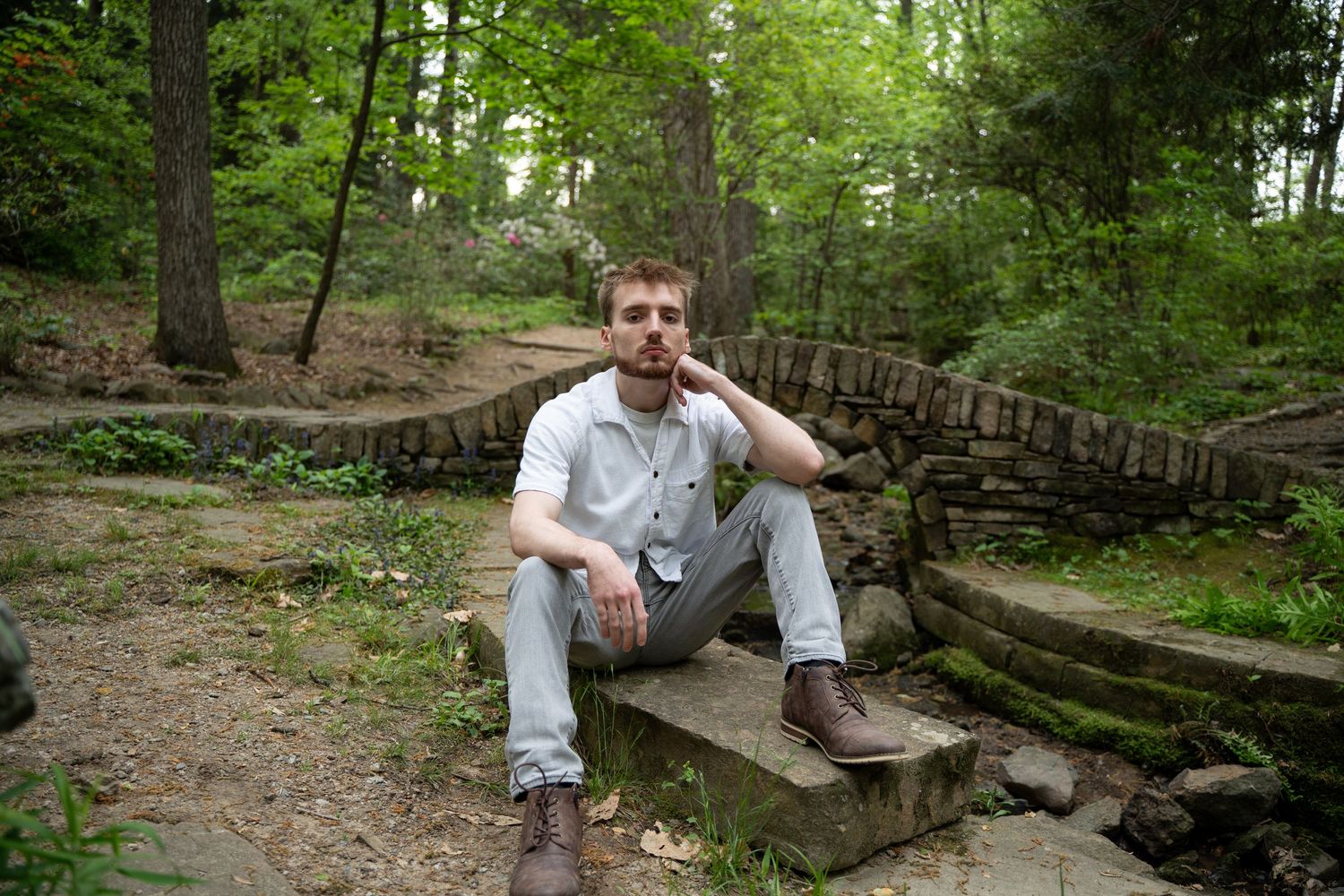 Stone steps and natural landscaping in a wooded park setting.