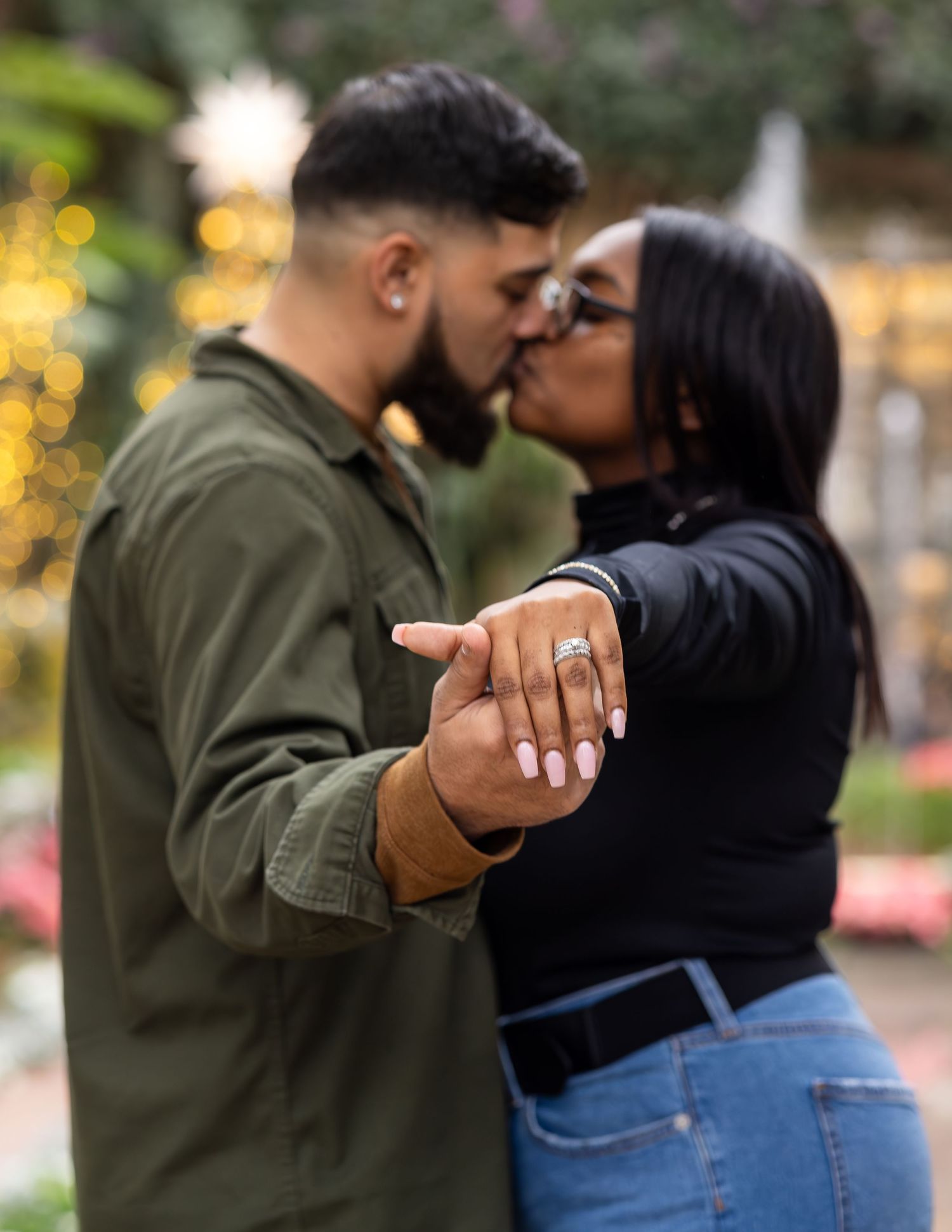 A romantic engagement photo showing off a new ring.