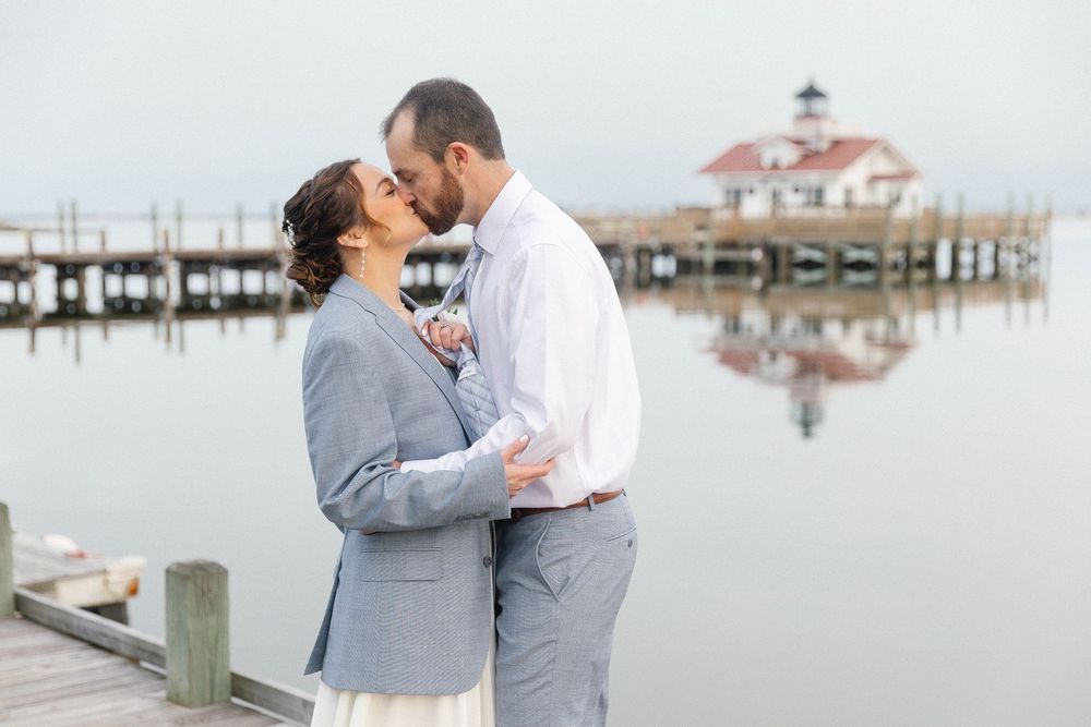 Romantic waterfront photos with a coastal gazebo reflected in calm waters.