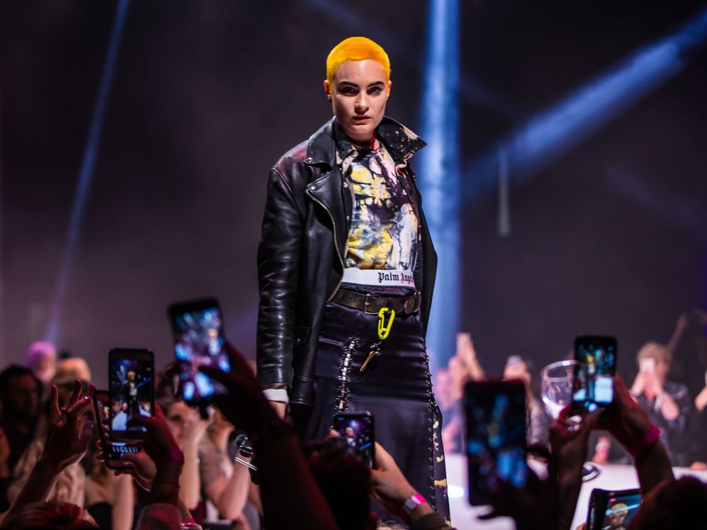 model posing at top of runway at show in Chicago