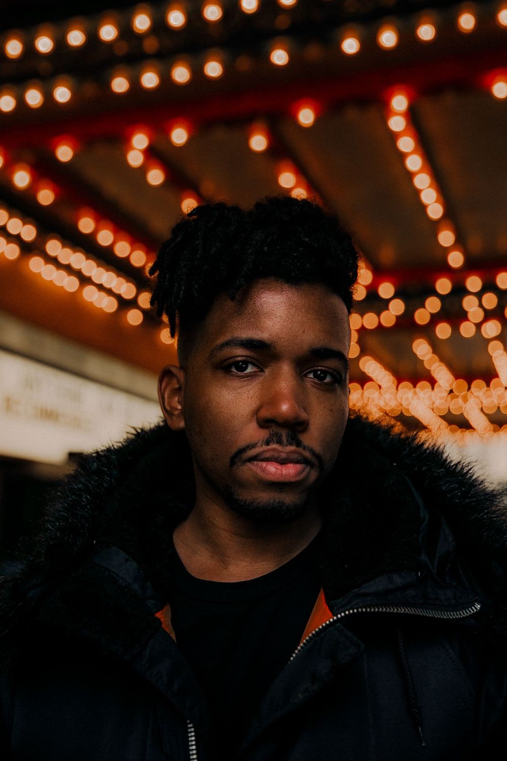Lewis McKinney standing outside Chicago theatre