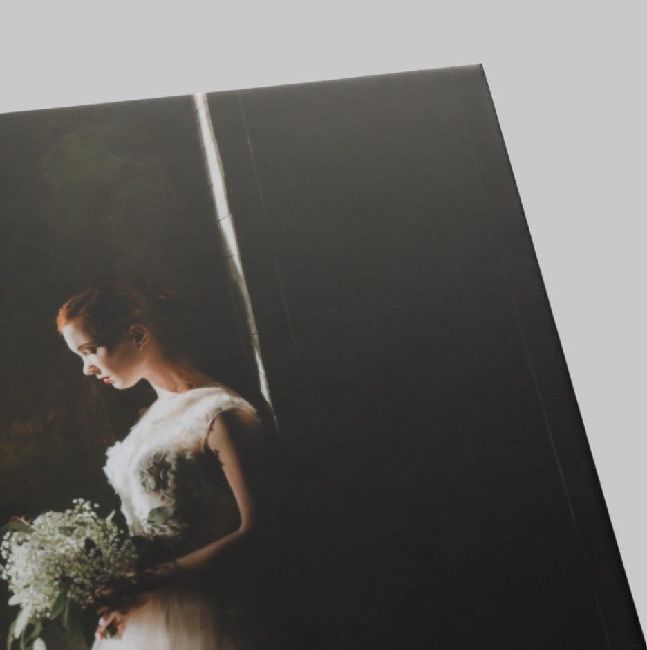 "Detailed view of the texture and finish of a professionally printed wedding photo.