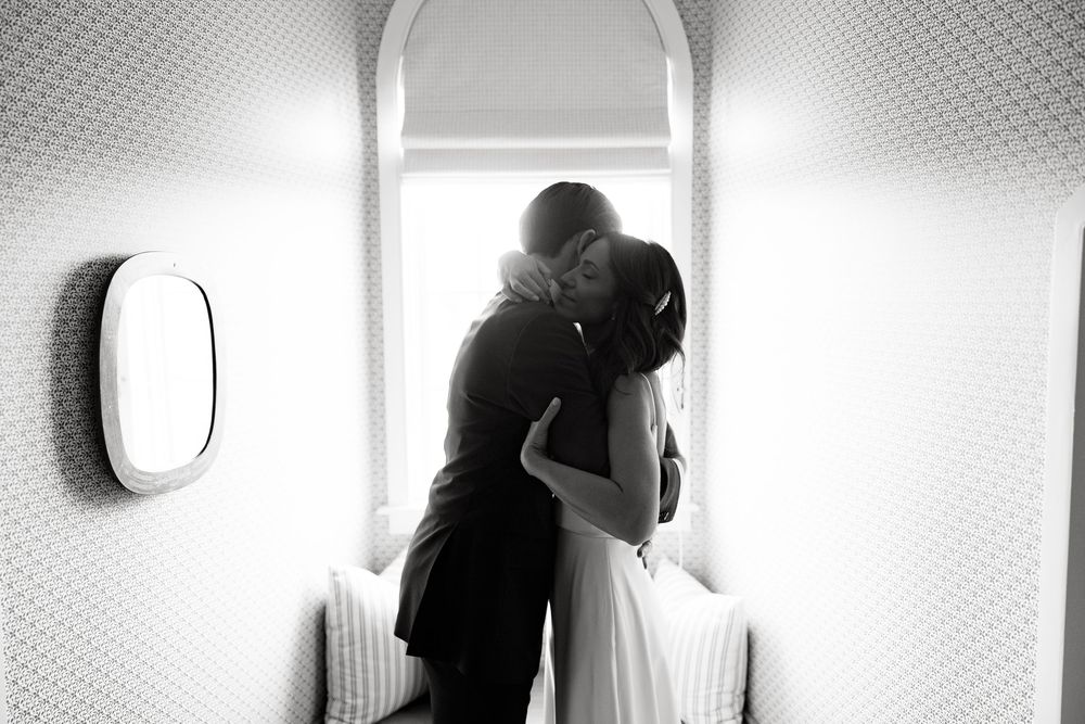 Black and white sequence of a person's silhouette moving through a space with light and shadow.