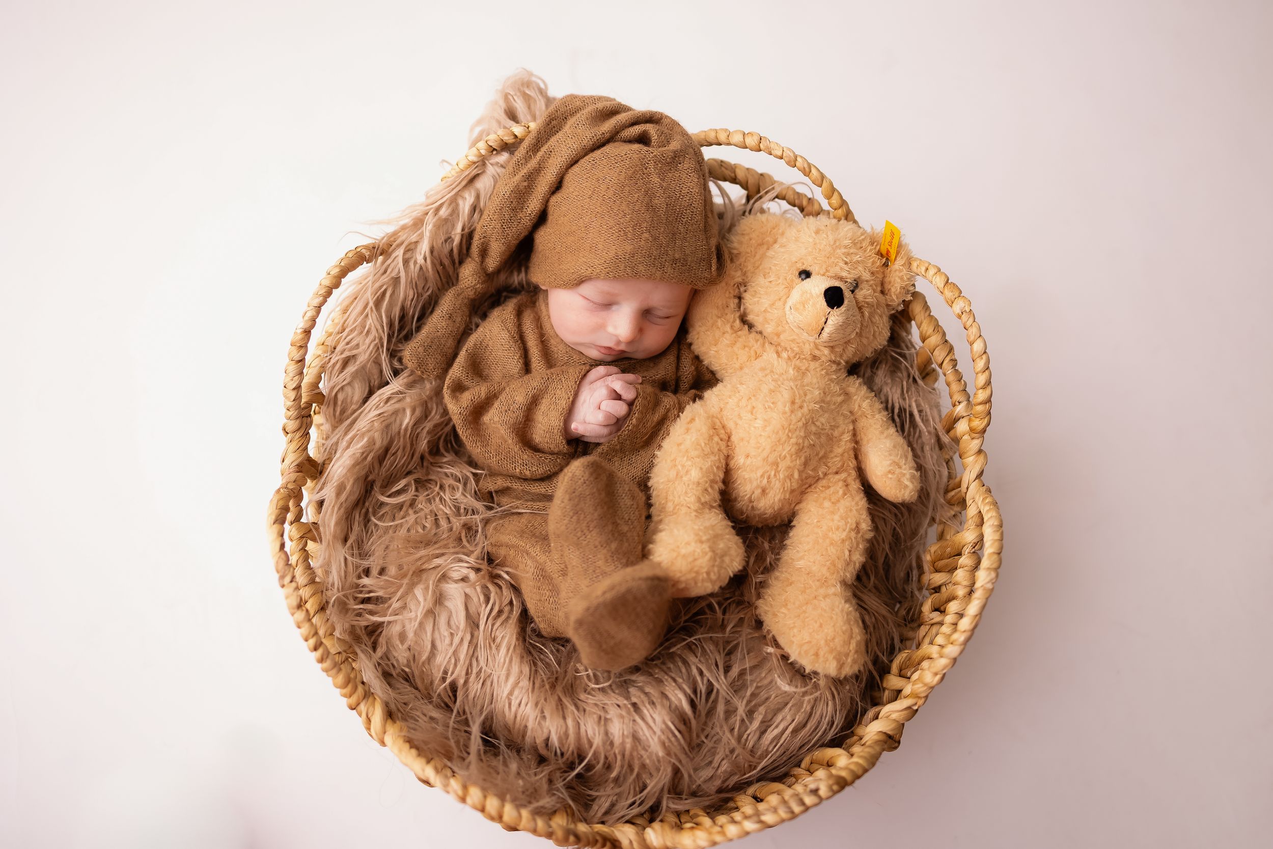Newborn studio photo session in Davison Michigan using props