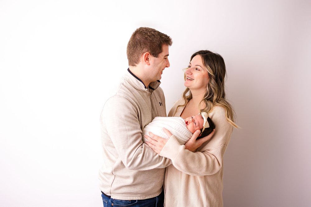 Newborn photo session in Davison, with family portraits.