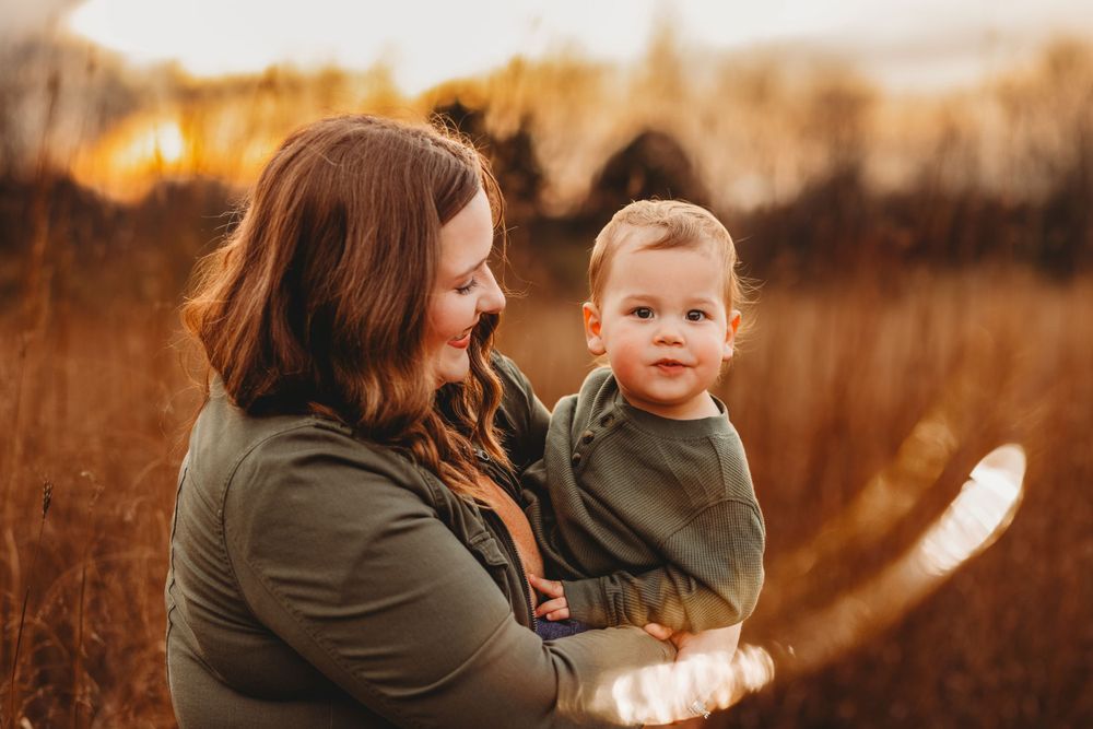Fall family session with mommy and son taken in the evening right during golden hour in Burton, Michigan