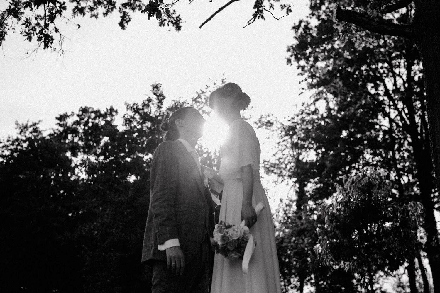Bride and groom sharing a romantic moment during their wedding photo shoot.