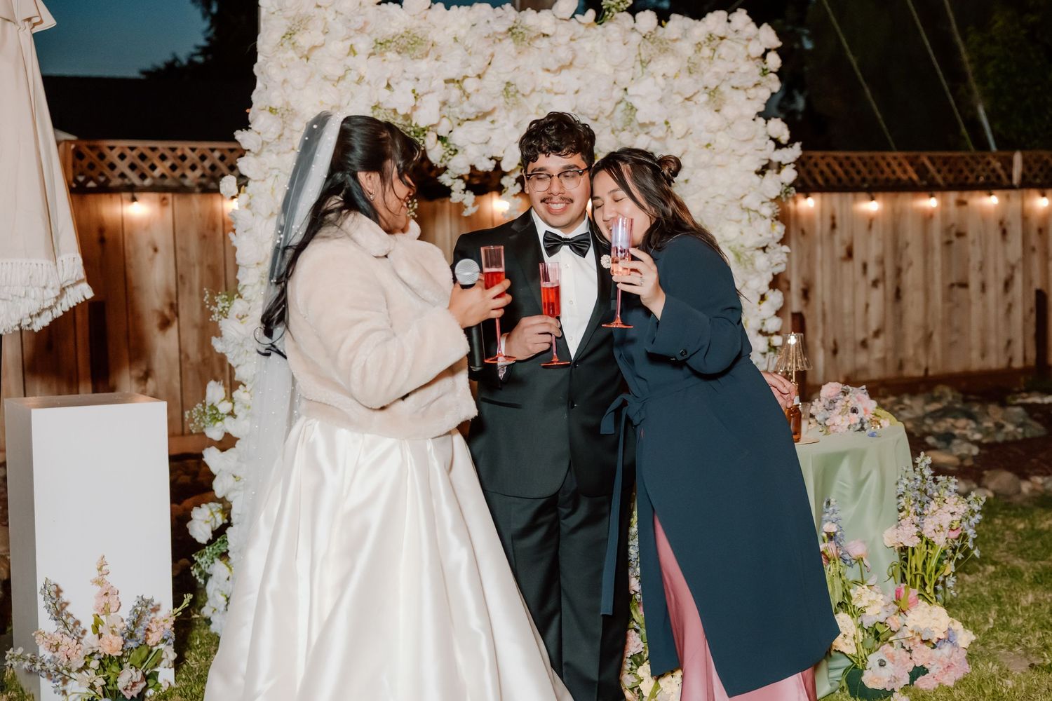 A wedding venue with a photo collage showing reception decor, dancing guests, and romantic moments amid soft lighting.