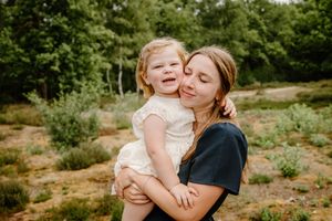 Candid family moments captured in a natural outdoor setting.