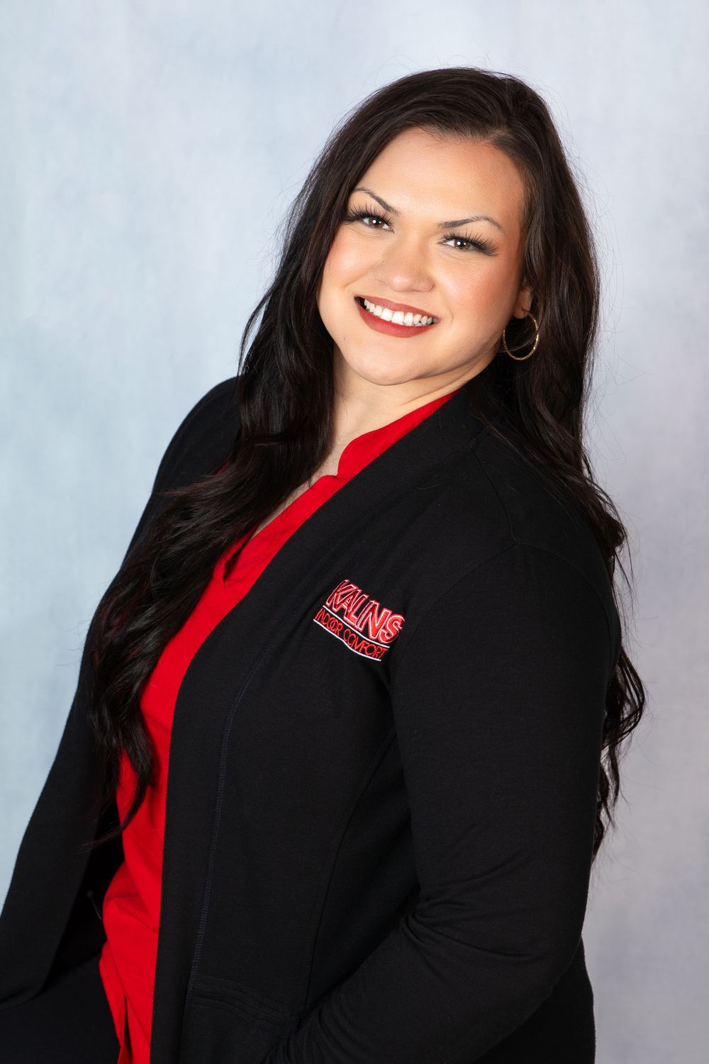 Truly Juli Photography headshot of a female Kalins Indoor Comfort employee wearing a red shirt and black cardigan