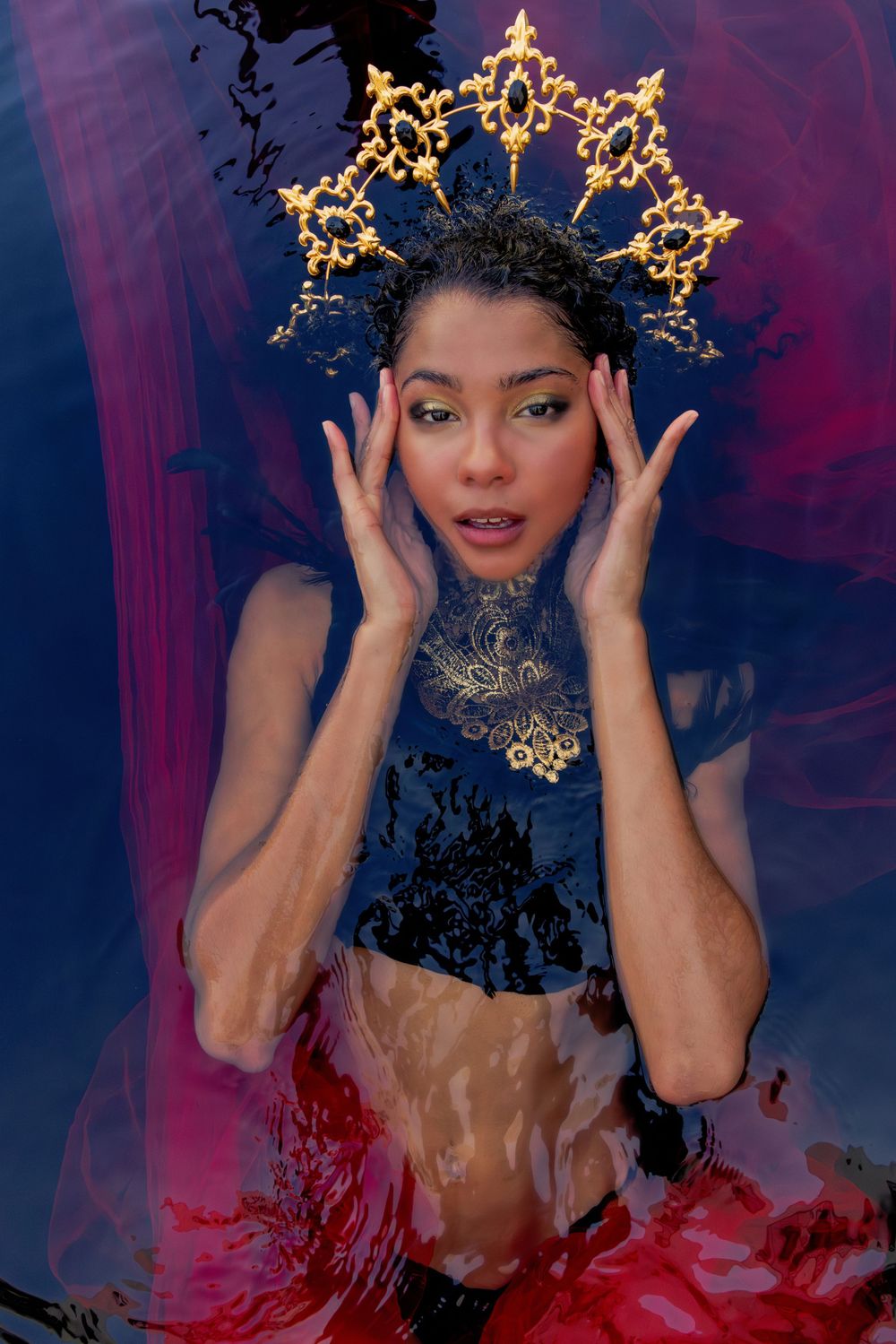 Artistic portrait with glowing crown effect against purple background.