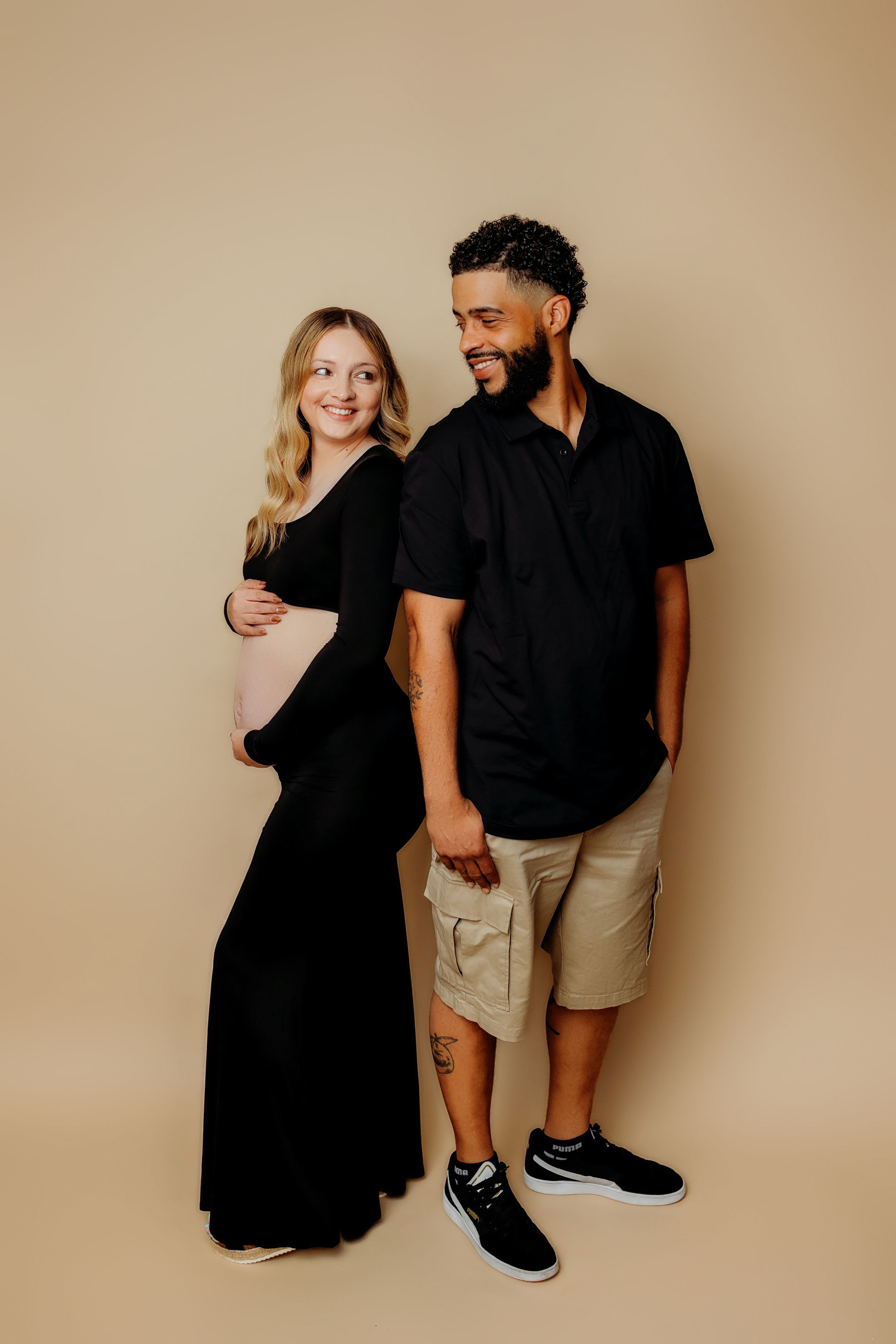 Casual family photo sequence with coordinated black and khaki outfits.