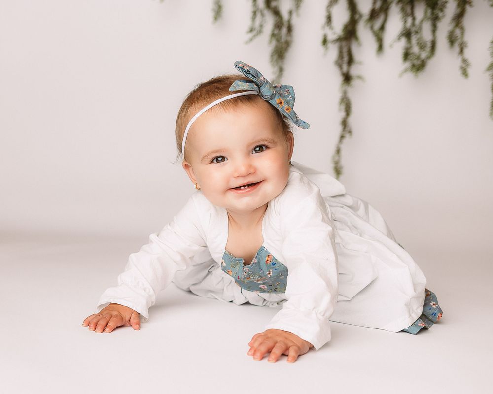 Professional photo of a toddler in white