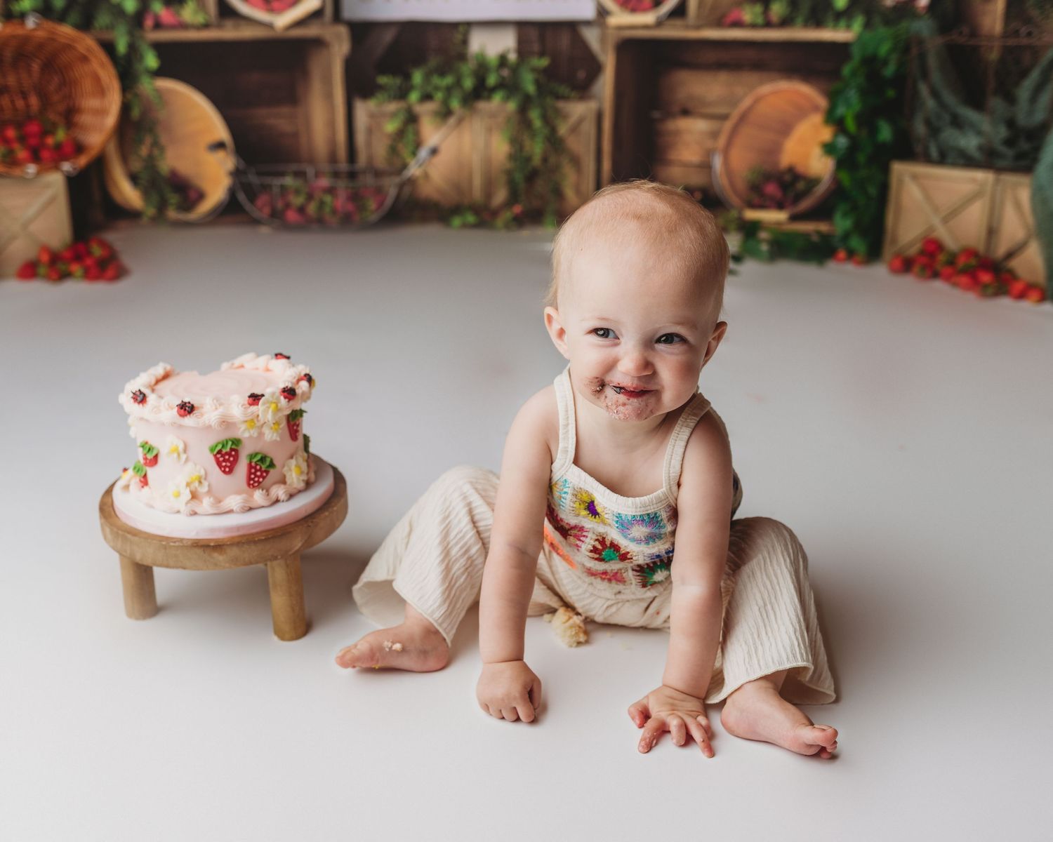 strawberry themed cake smash session in central maine with a little girl
