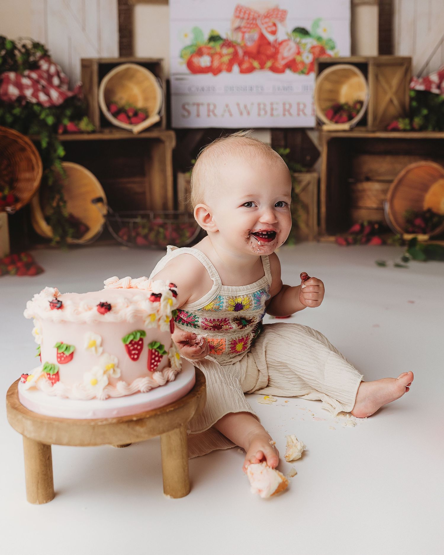 little girl has studio cake smash birthday session in central maine studio
