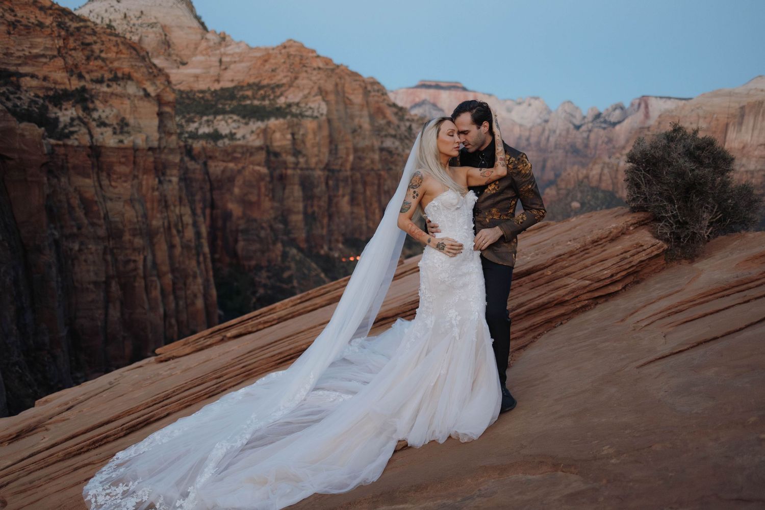 Couple embracing during Zion elopement at Canyon Overlook.