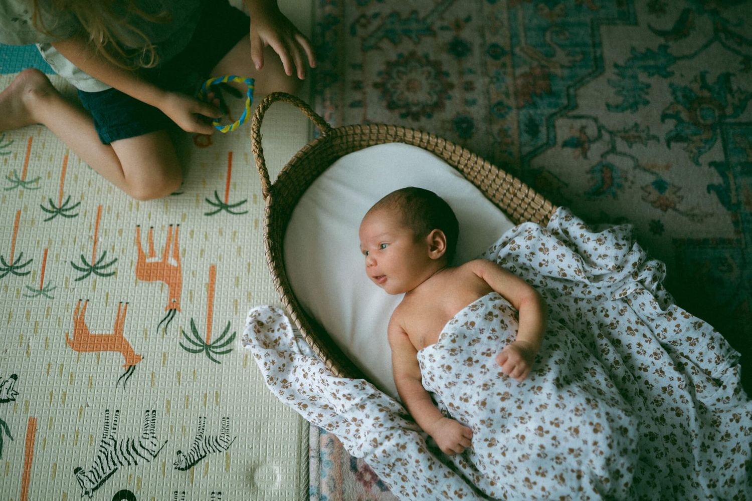 Melbourne family snuggling on the couch with their newborn son