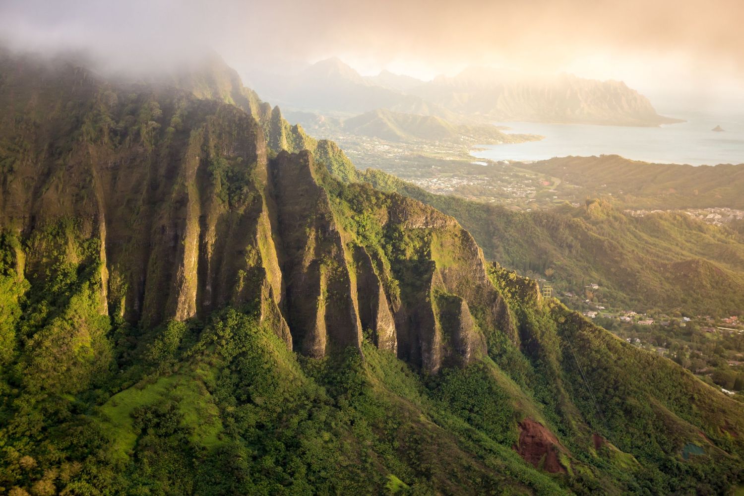 Majestic green cliffs of the Na Pali Coast in Kauai during sunset.