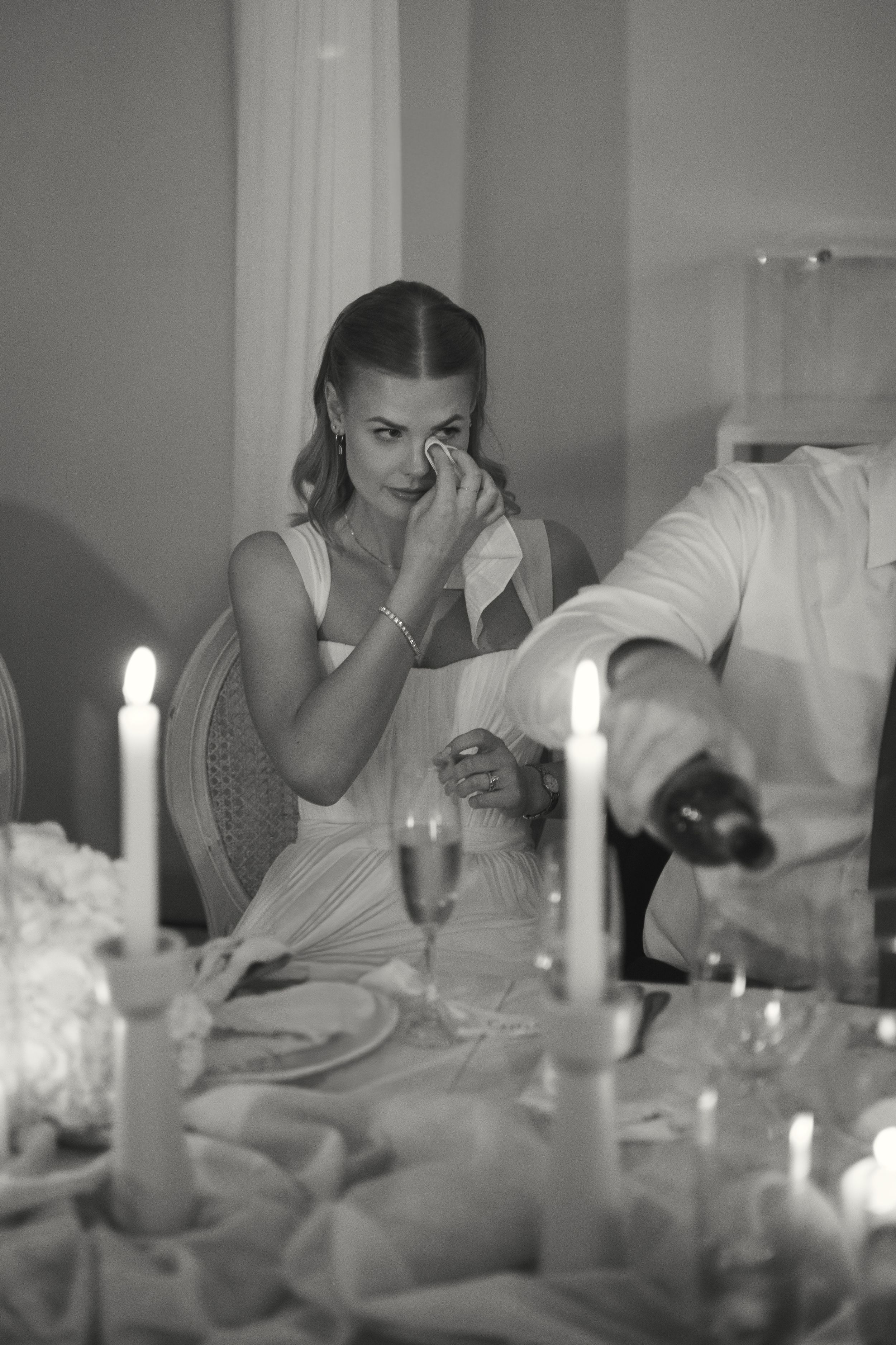 heartfelt bride moment black and white real moments candle light reception