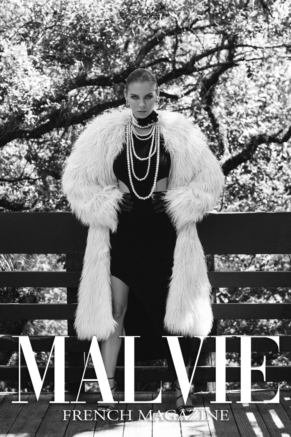 Fashion magazine cover featuring model in fur coat and pearl necklaces.