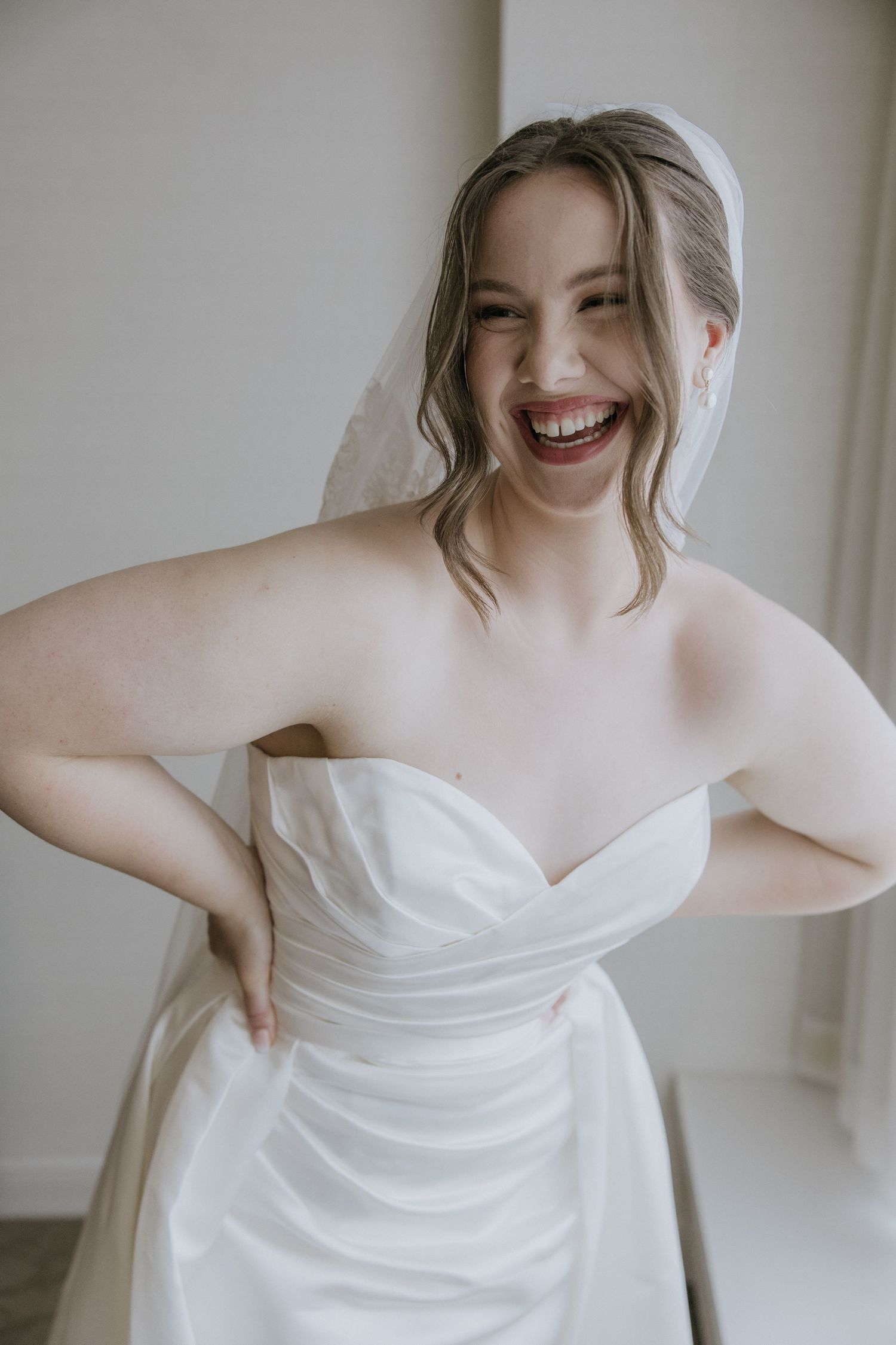 A series of candid shots showing a bride in a white strapless wedding dress against a light background.