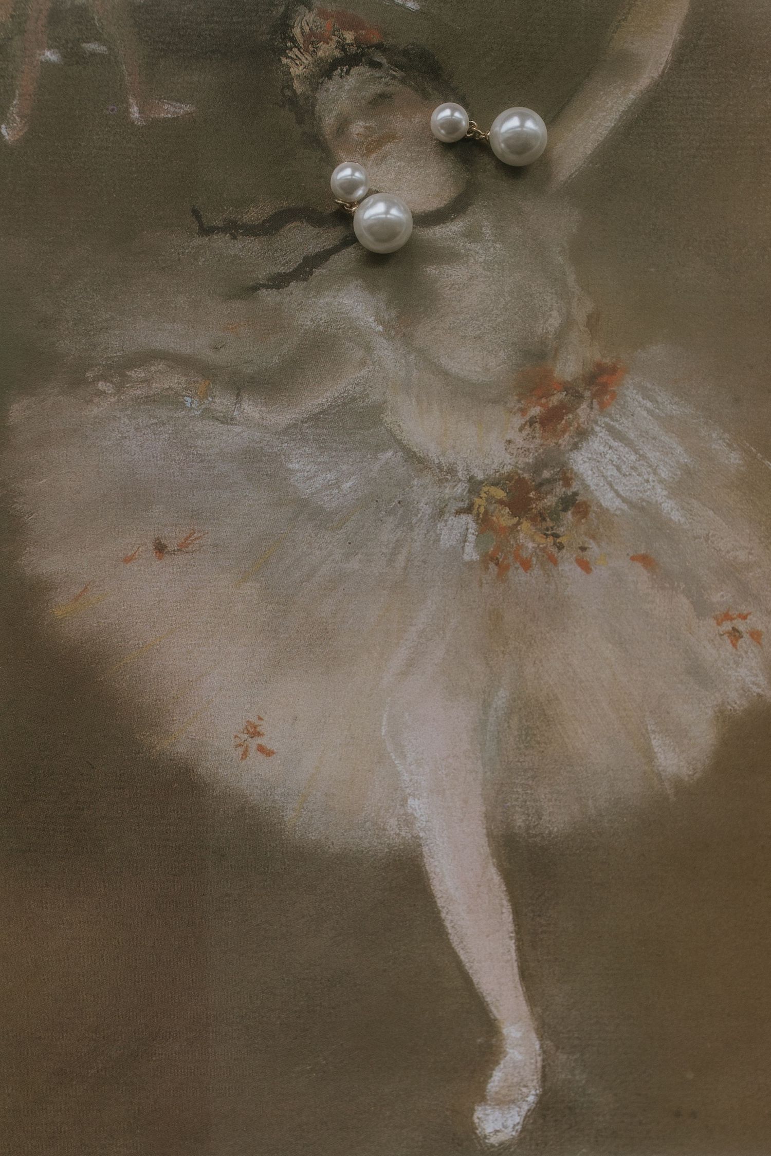 Impressionist painting of a ballet dancer in a white tutu with pearls performing on stage in soft, ethereal lighting.