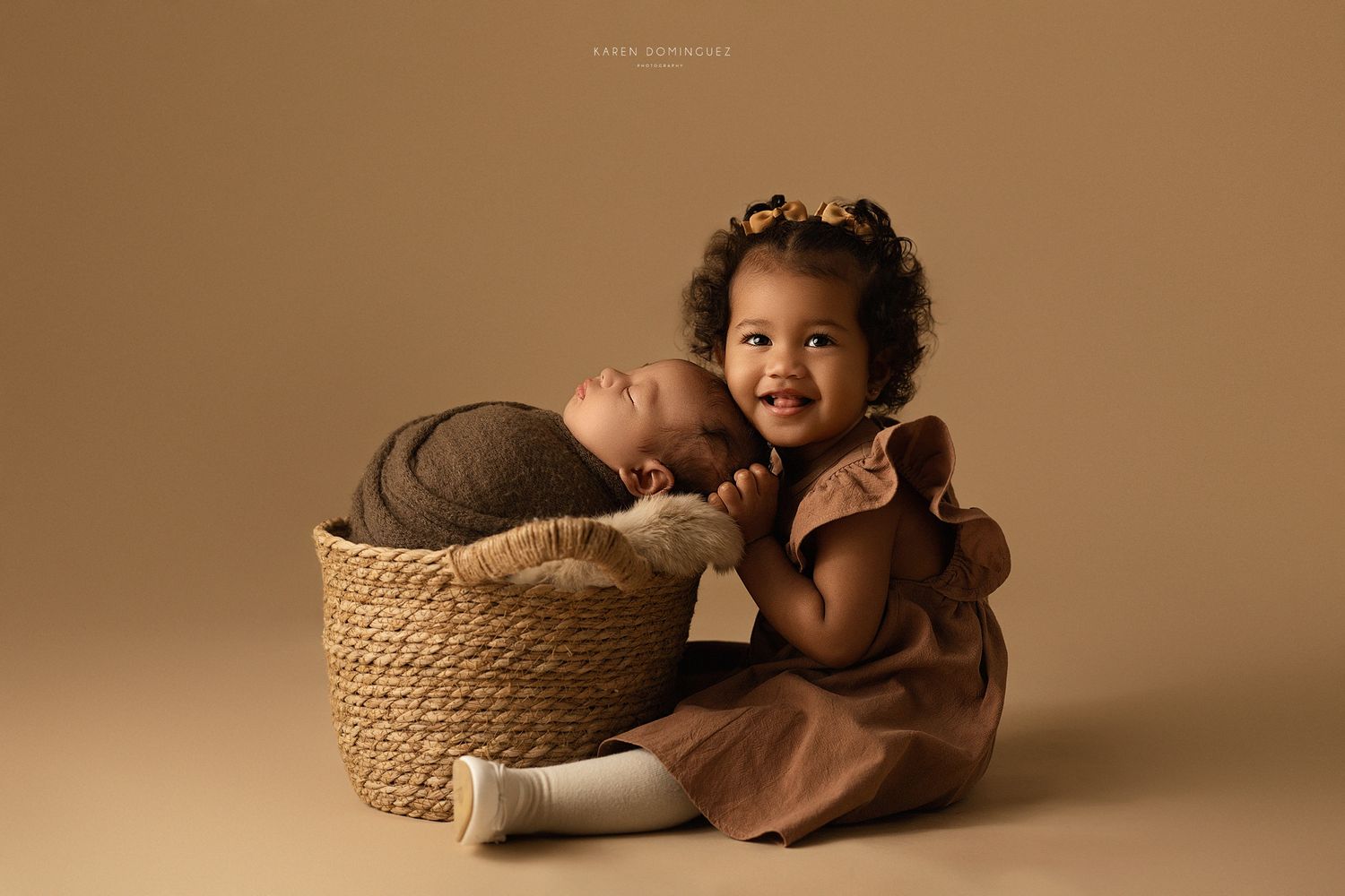 Sibling photoshoot of sister and baby brother.