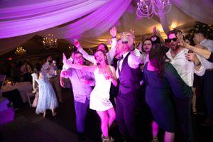 Bride changes into a reception dress to party with her guests more comfortably.