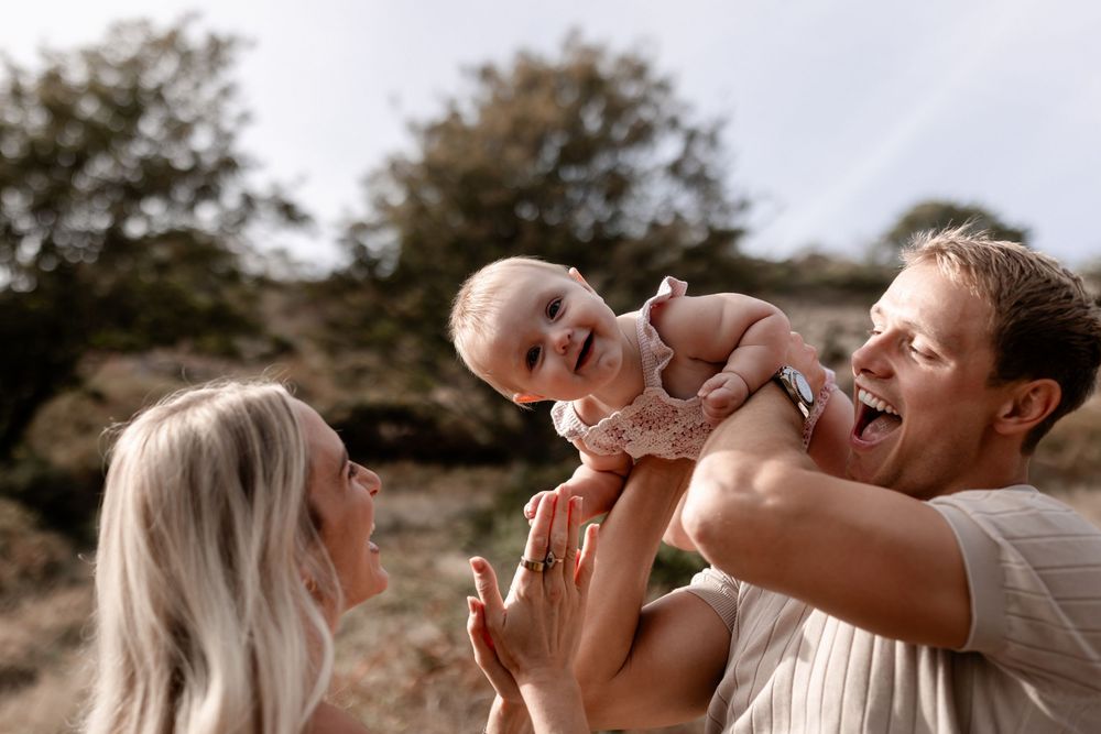 Candid moments of playful interaction captured during sunset in a natural setting.