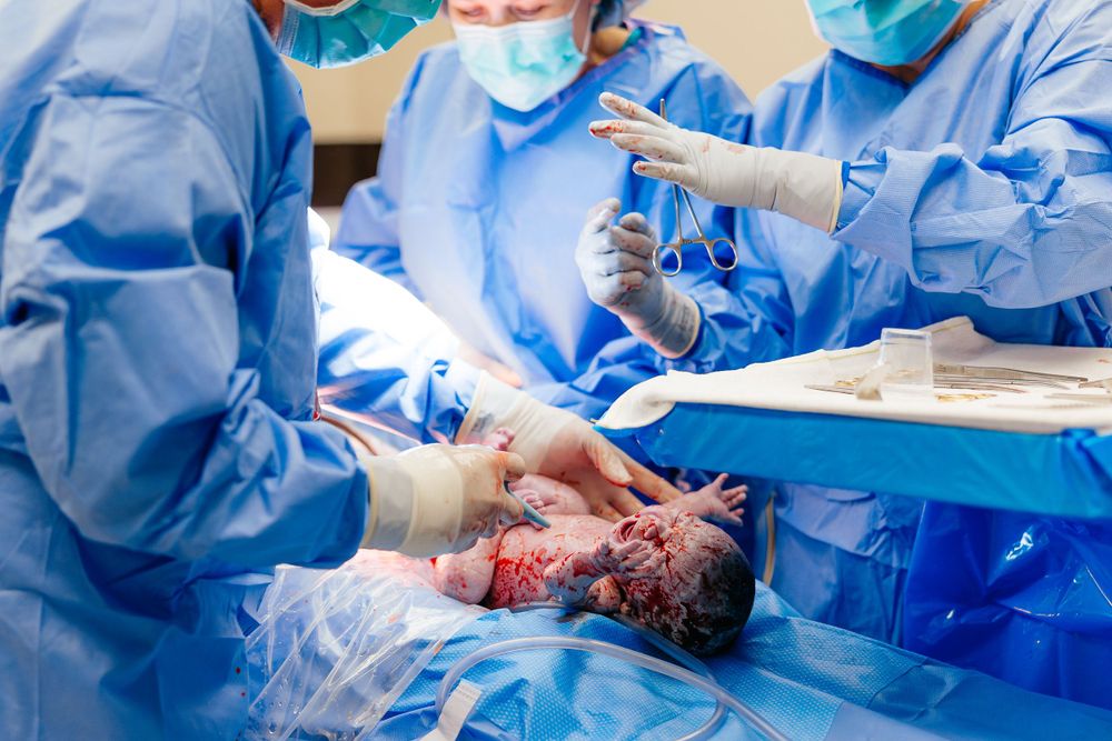 Medical team performing surgery in an operating room.