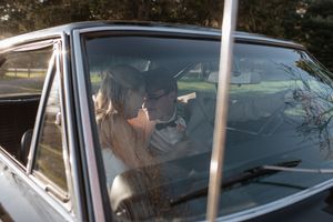Interior view of a classic vintage car through the passenger window.