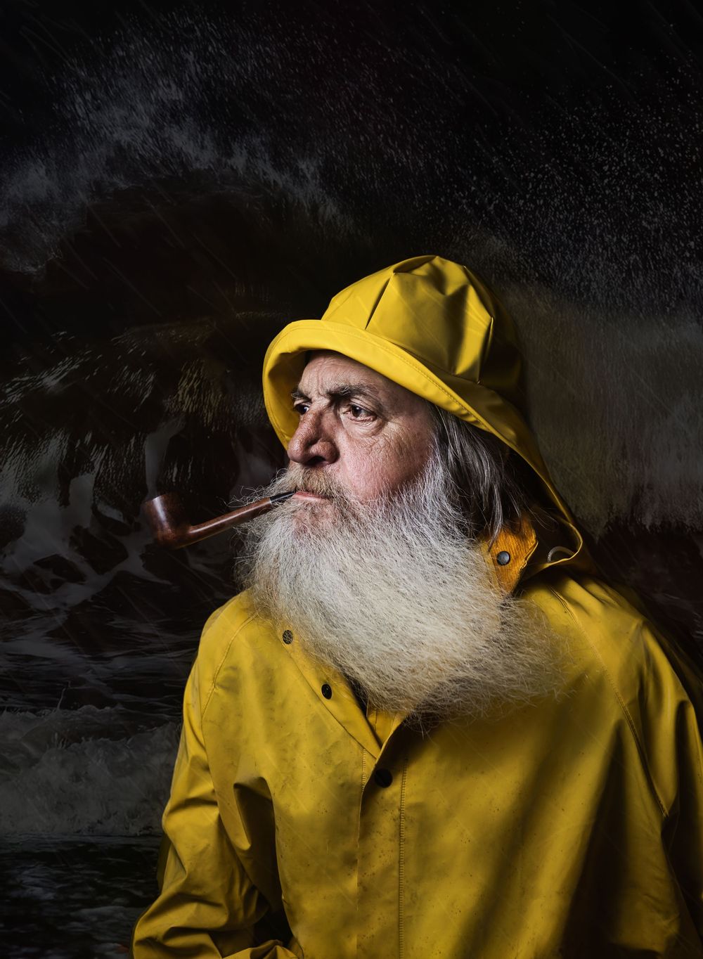 A person in a yellow raincoat gazes into stormy waters at night, creating a dramatic silhouette against dark skies.
