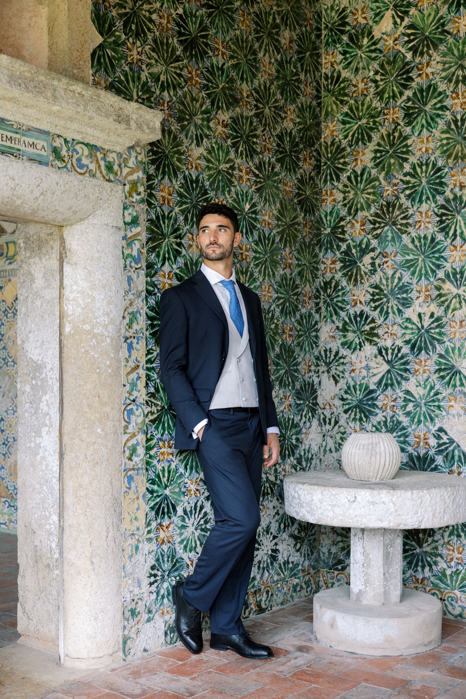 Groom portrait with traditional Portuguese tiles at Palácio da Bacalhôa