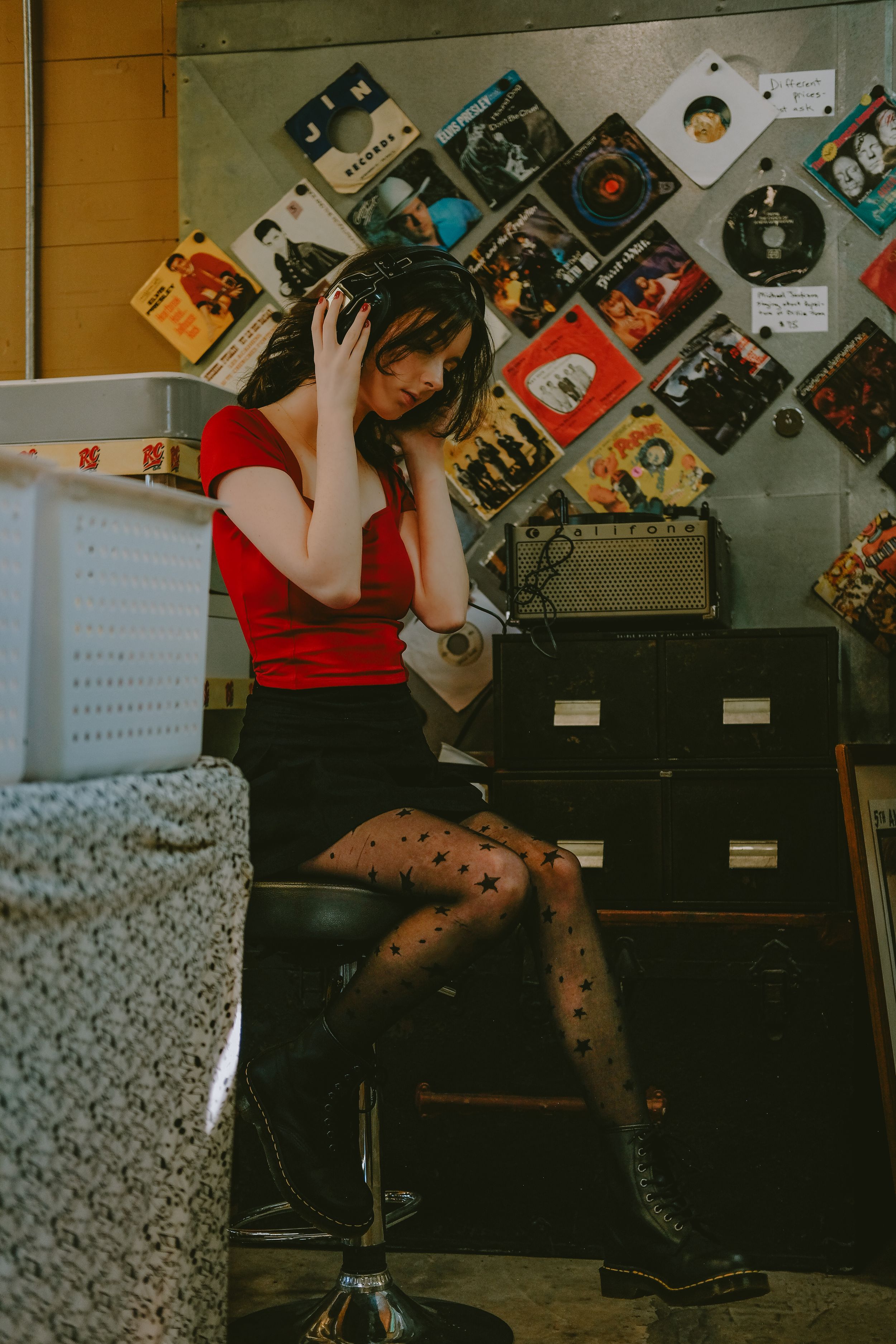 girl sitting on stool listening to headphones record store photo session Lafayette la
