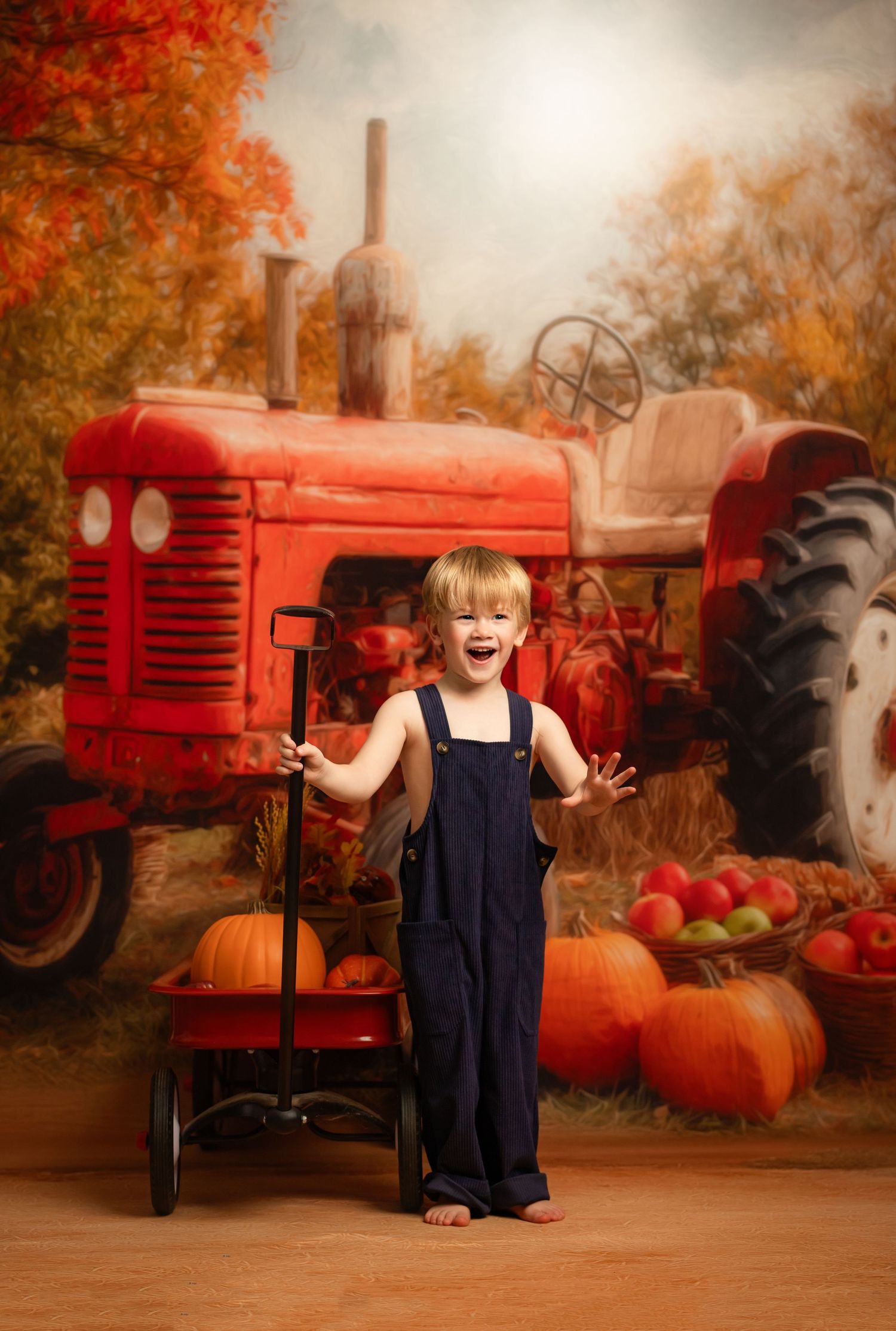 A vintage red tractor provides a beautiful rustic backdrop for autumn portraits with pumpkins and fall foliage.