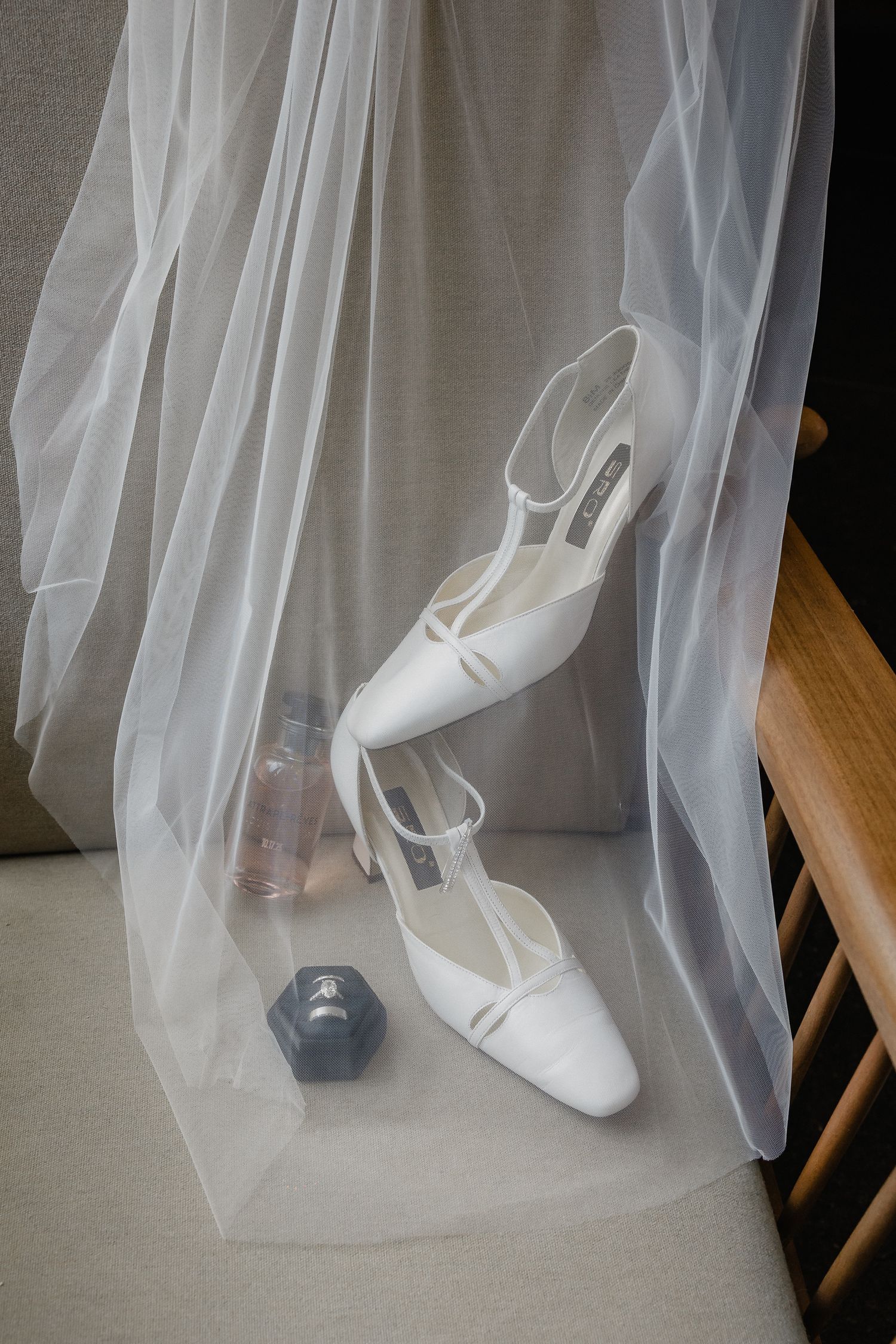 Wedding shoes and veil arranged in a sequence showing different angles against a light background.
